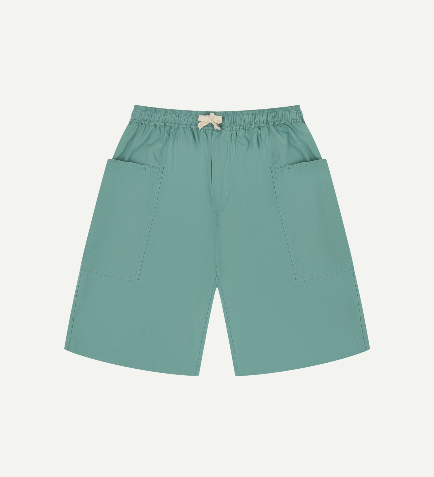 Front view of eucalyptus green organic cotton #5015 lightweight cotton shorts by Uskees. Clear view of elasticated waist and deep front pockets.