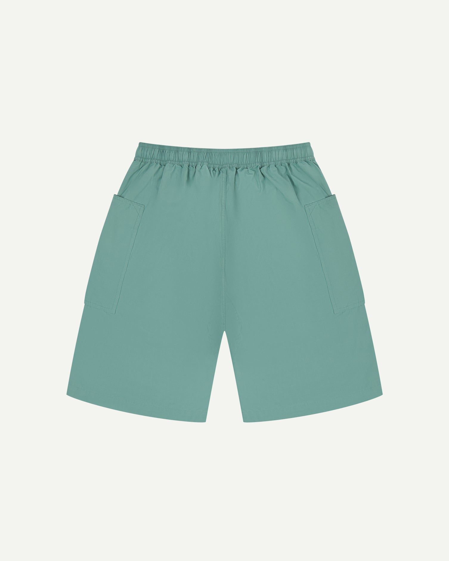Back view of eucalyptus green organic cotton #5015 lightweight cotton shorts by Uskees. Clear view of elasticated waist .
