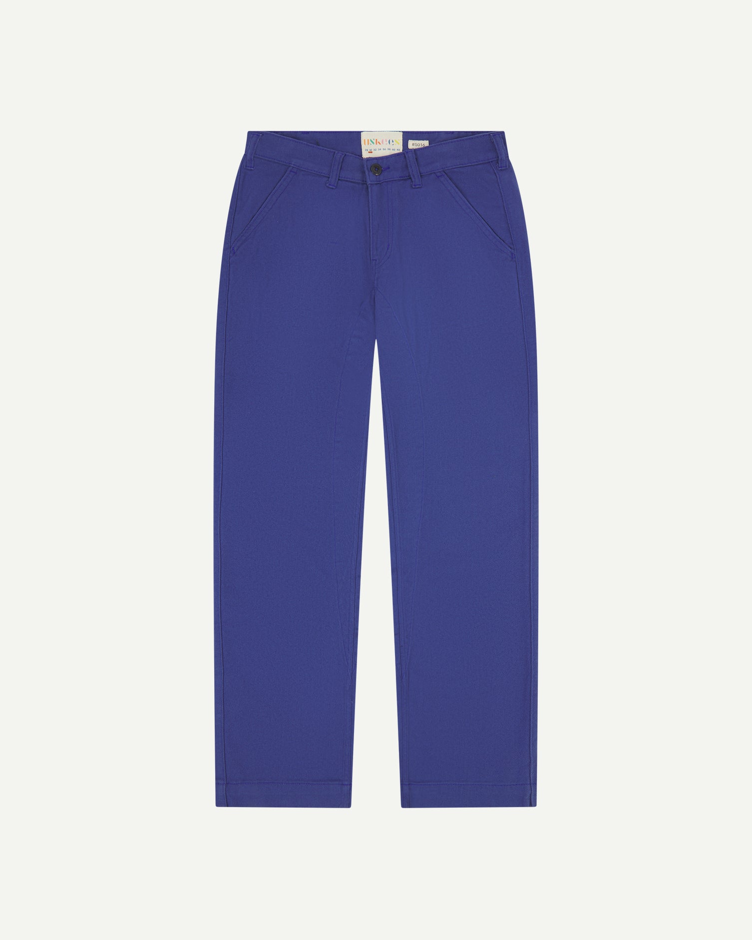 Front flat shot of Uskees cotton drill 'commuter' trousers for men in ultra blue showing brand label at waist