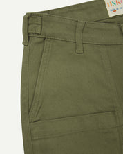 Close up shot of Uskees #5013 drill men's trousers showing pocket and waistband detail
