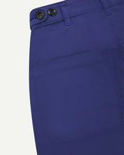 Close up shot of ultra blue drill trousers from uskees showing back pocket and waist band button adjusters