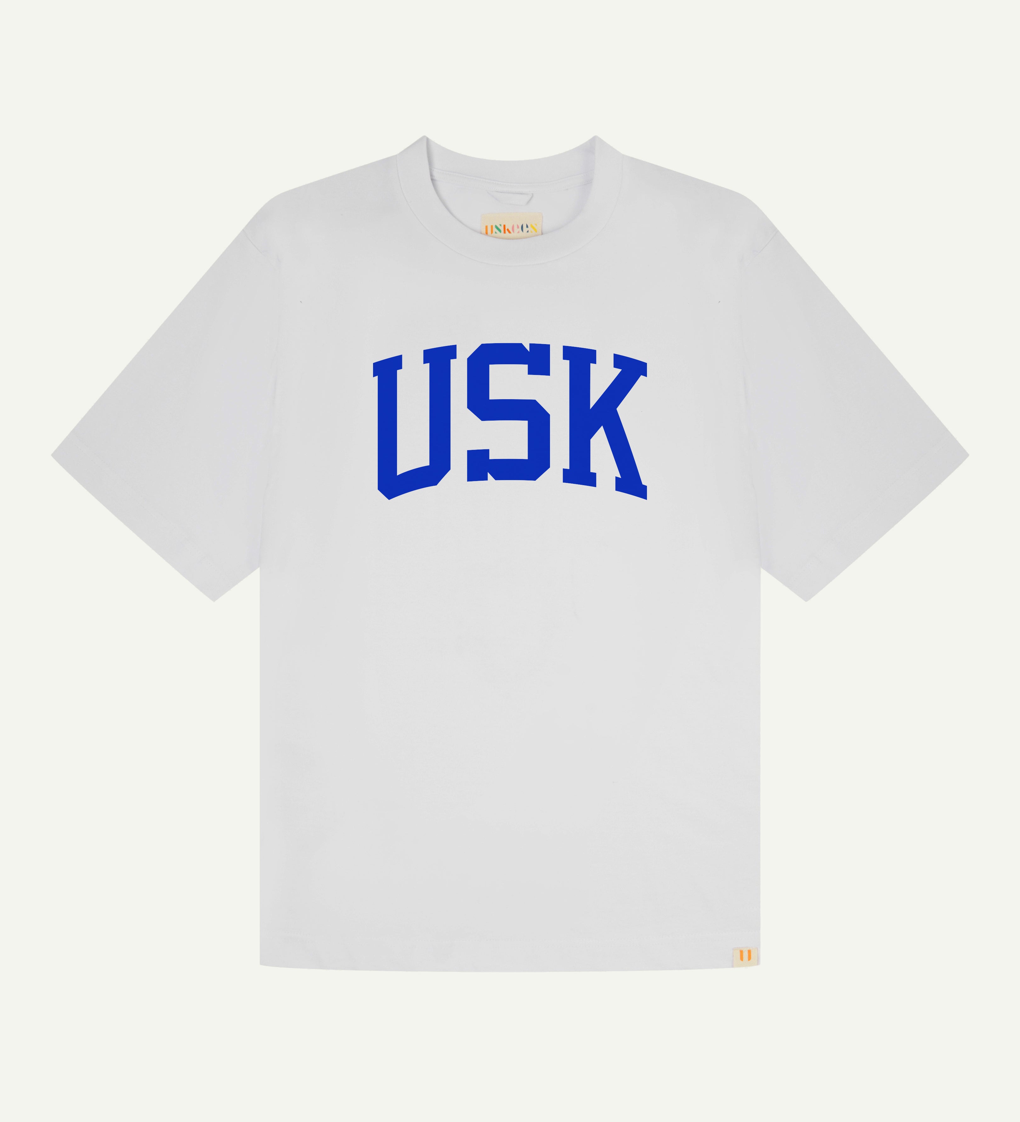 front flat shot of uskees signature relaxed fit T-shirt in white with an ultra blue USK logo on the front 