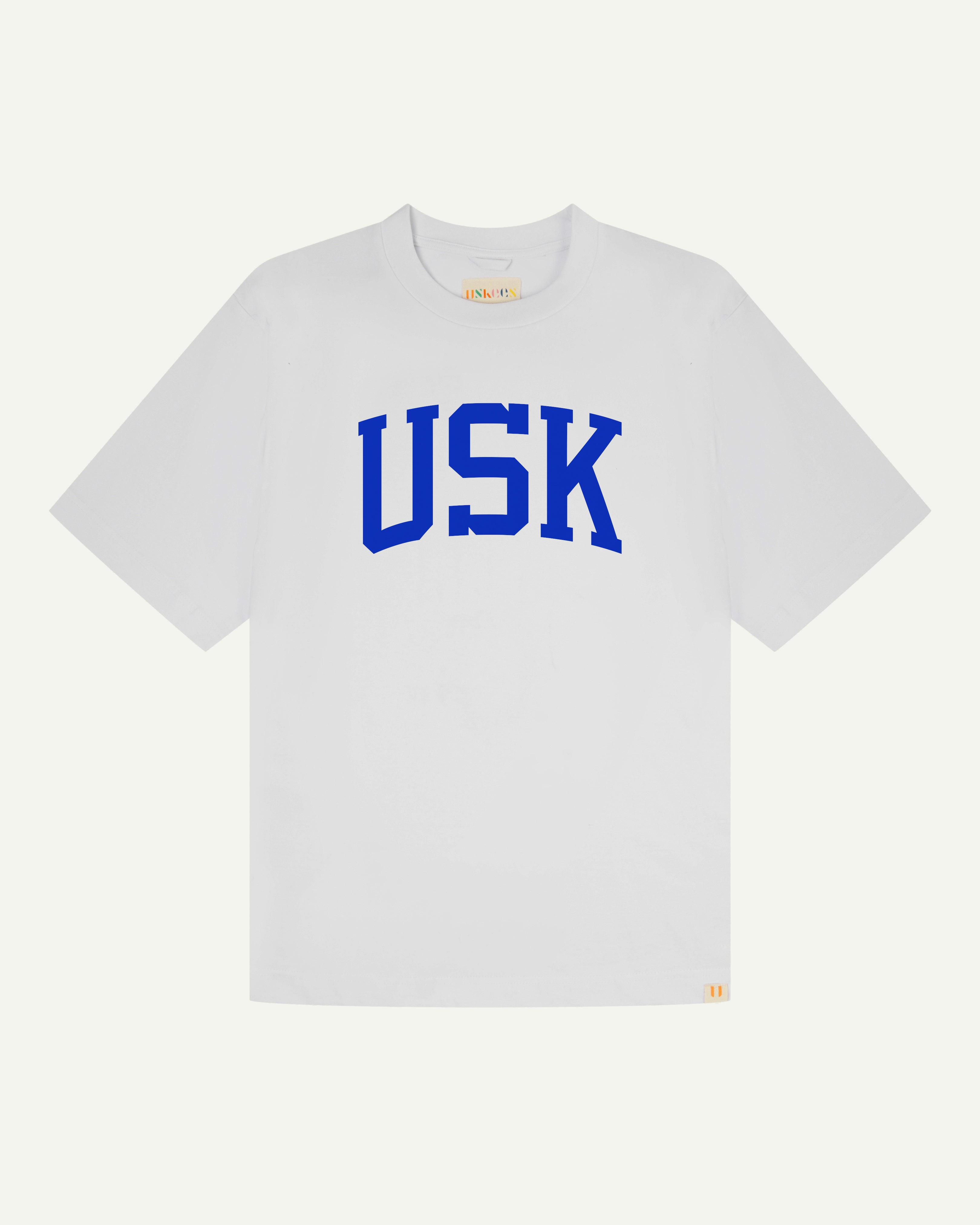 front flat shot of uskees signature relaxed fit T-shirt in white with an ultra blue USK logo on the front 