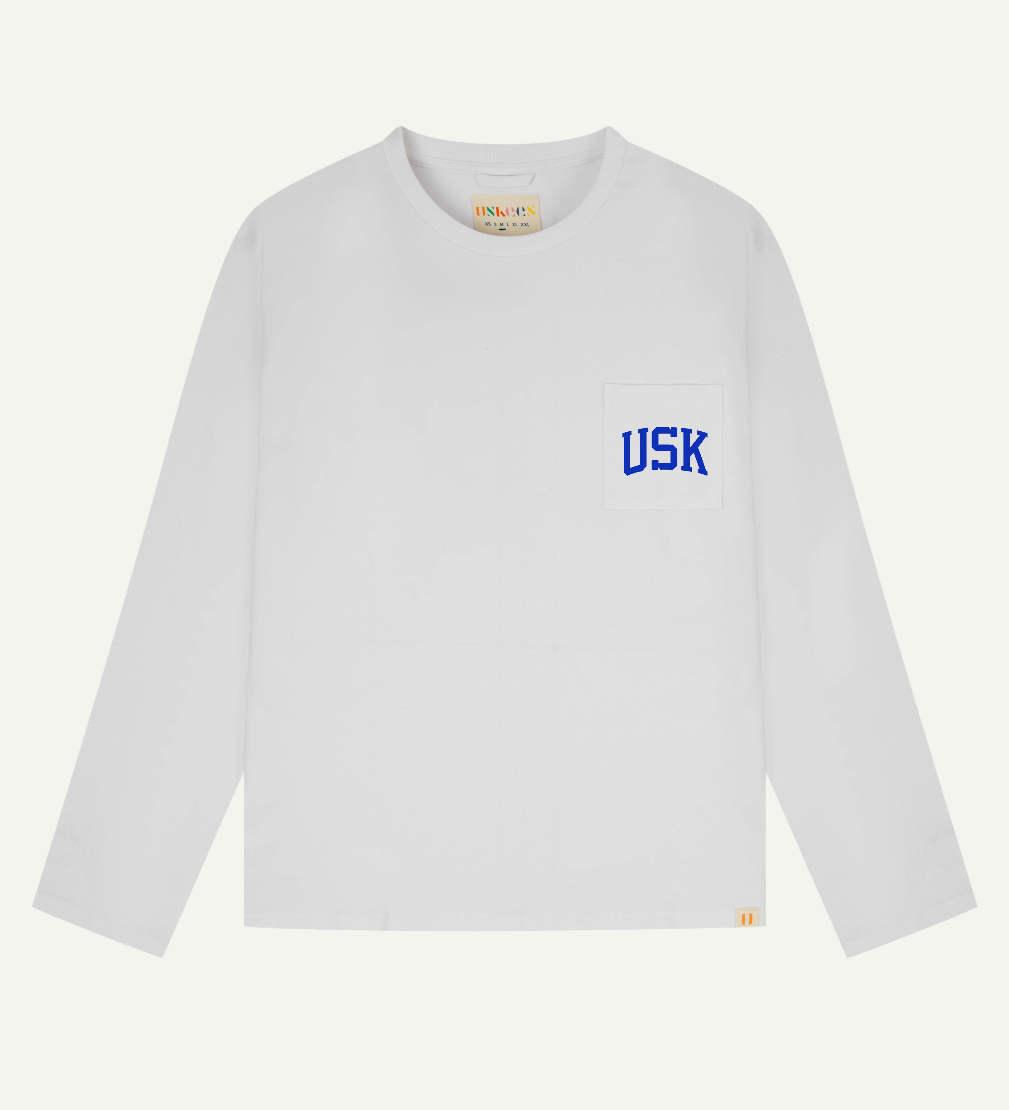 front flat shot of the uskees white long sleeved Tee showing the ultra blue  USK logo on the chest pocket