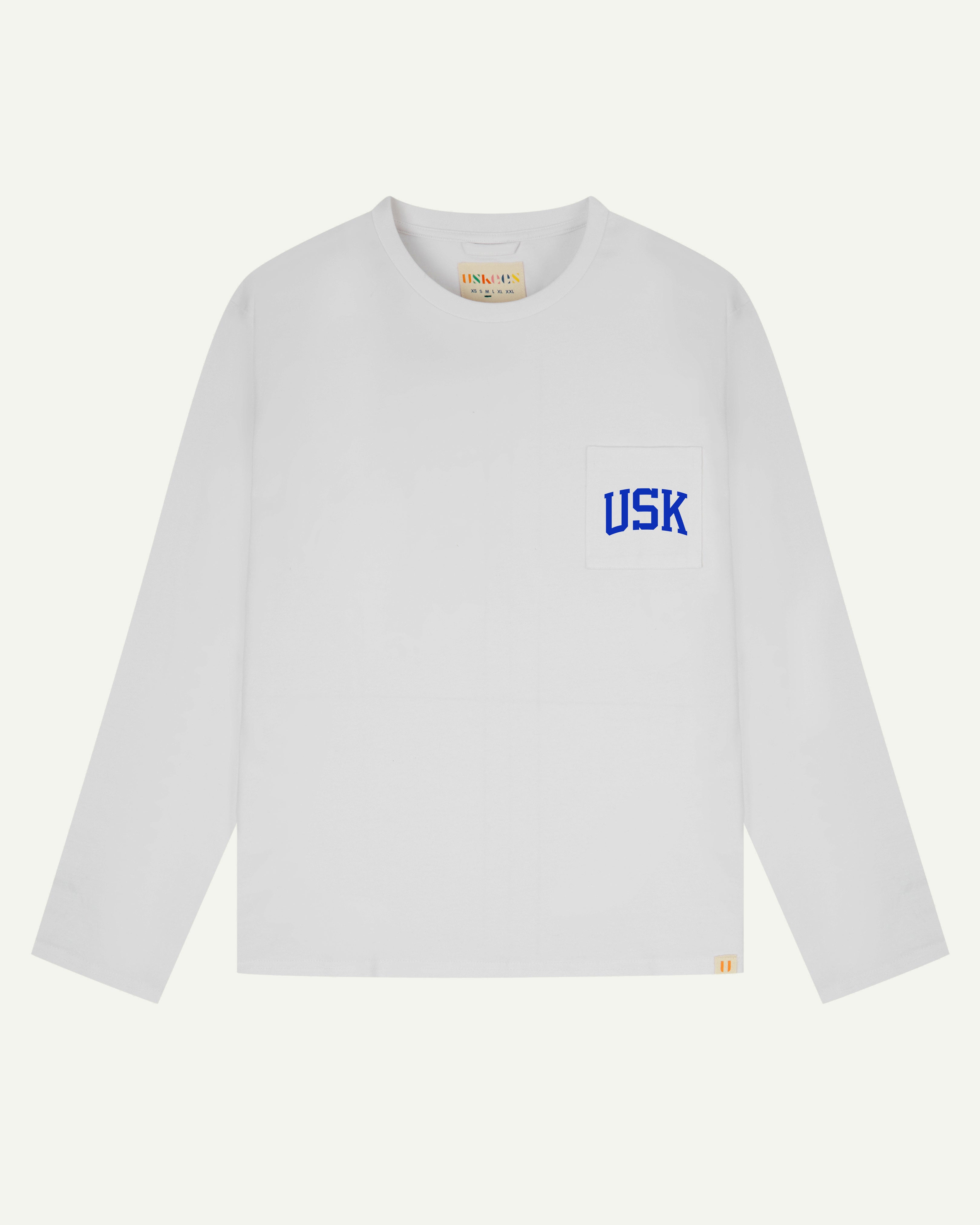 front flat shot of the uskees white long sleeved Tee showing the ultra blue  USK logo on the chest pocket