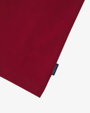 Front close up shot of a men's red graphic t-shirt with 'USKEES' logo tab on the seam. Presented on a white background