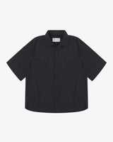 Front flat view of an Uskees dark blue short sleeved men's shirt, presented on a white background