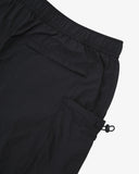 Close shot of Uskees black trek shorts for men showing the side and back pockets, Presented on a light gray background