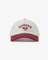 Front view of an Uskees Baseball Cap in  a red and cream design on a white background.