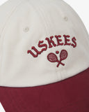 Cream and red Baseball cap with 'USKEES' logo on a white background