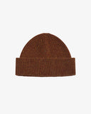 Uskees chestnut brown beanie on a light gray background
