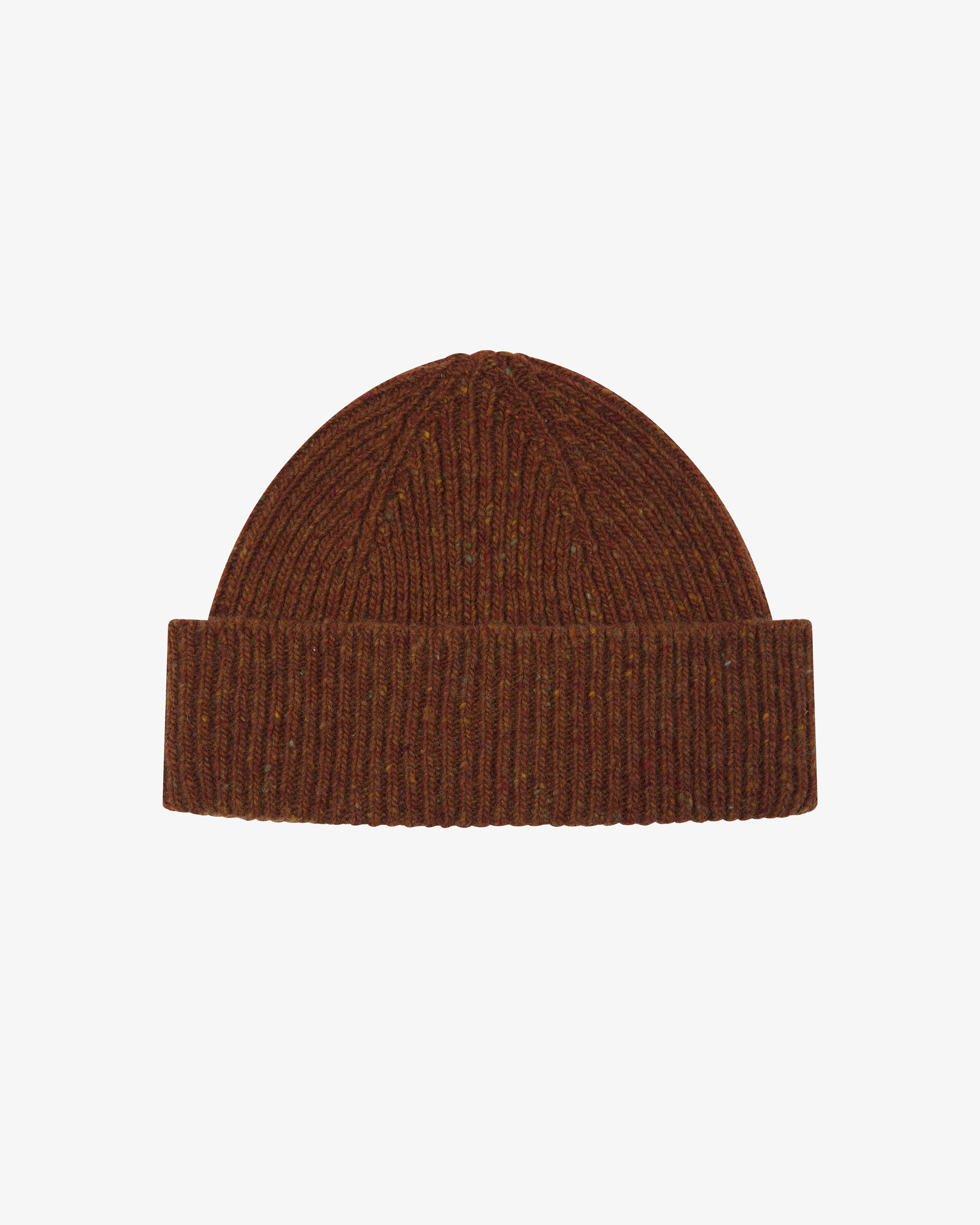 Brown speckled knit beanie on a light coloured background