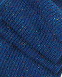 Close up shot of an Uskees ultra blue unisex Donegal wool scarf showing the speckled ribbed effect.