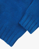 Close up shot of Uskees ultra blue roll neck sweater for menshowing the ribbed cuff and hem detail.
