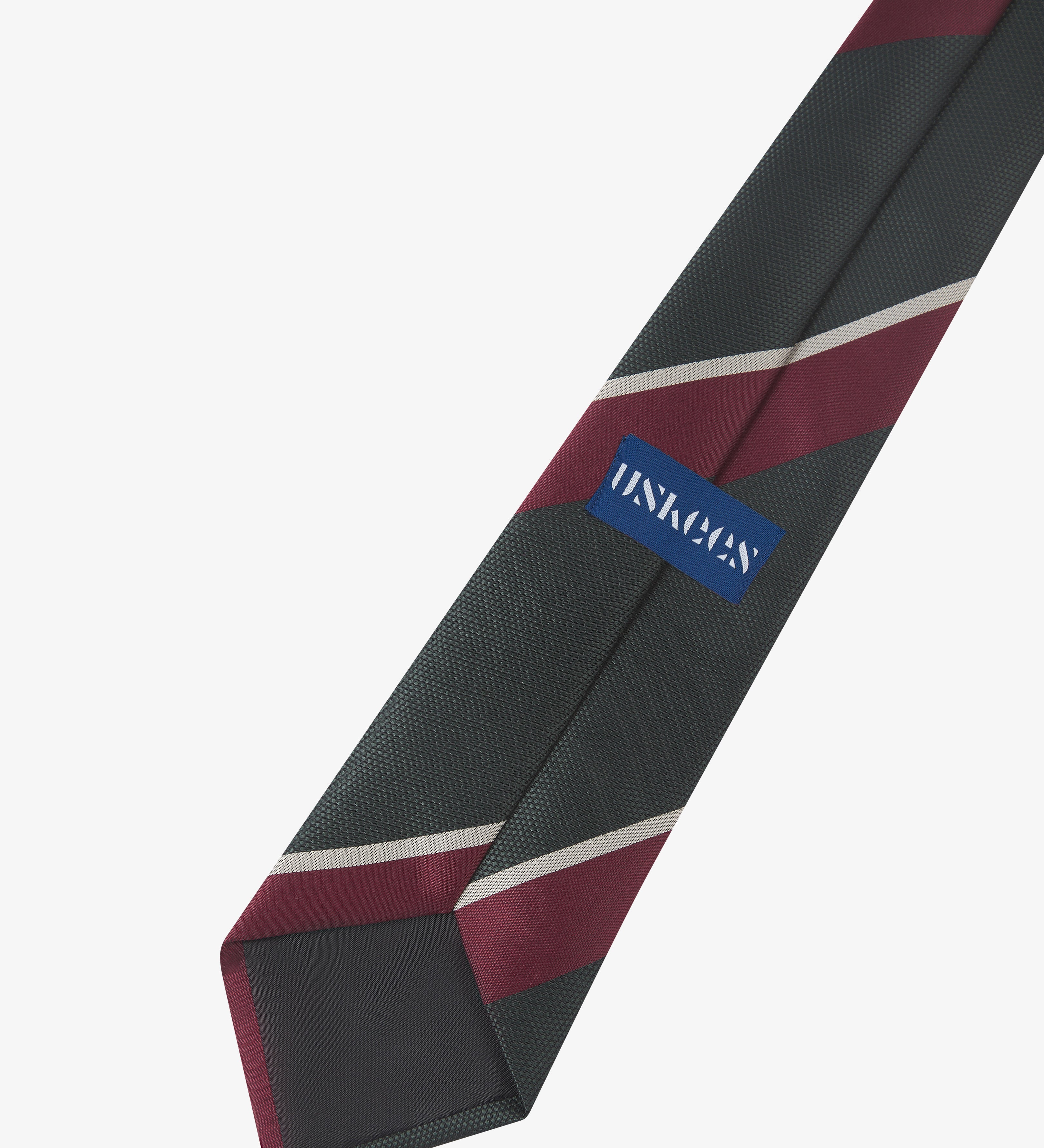 Back view of Uskees Repp coriander green and red striped tie showing the brand label.