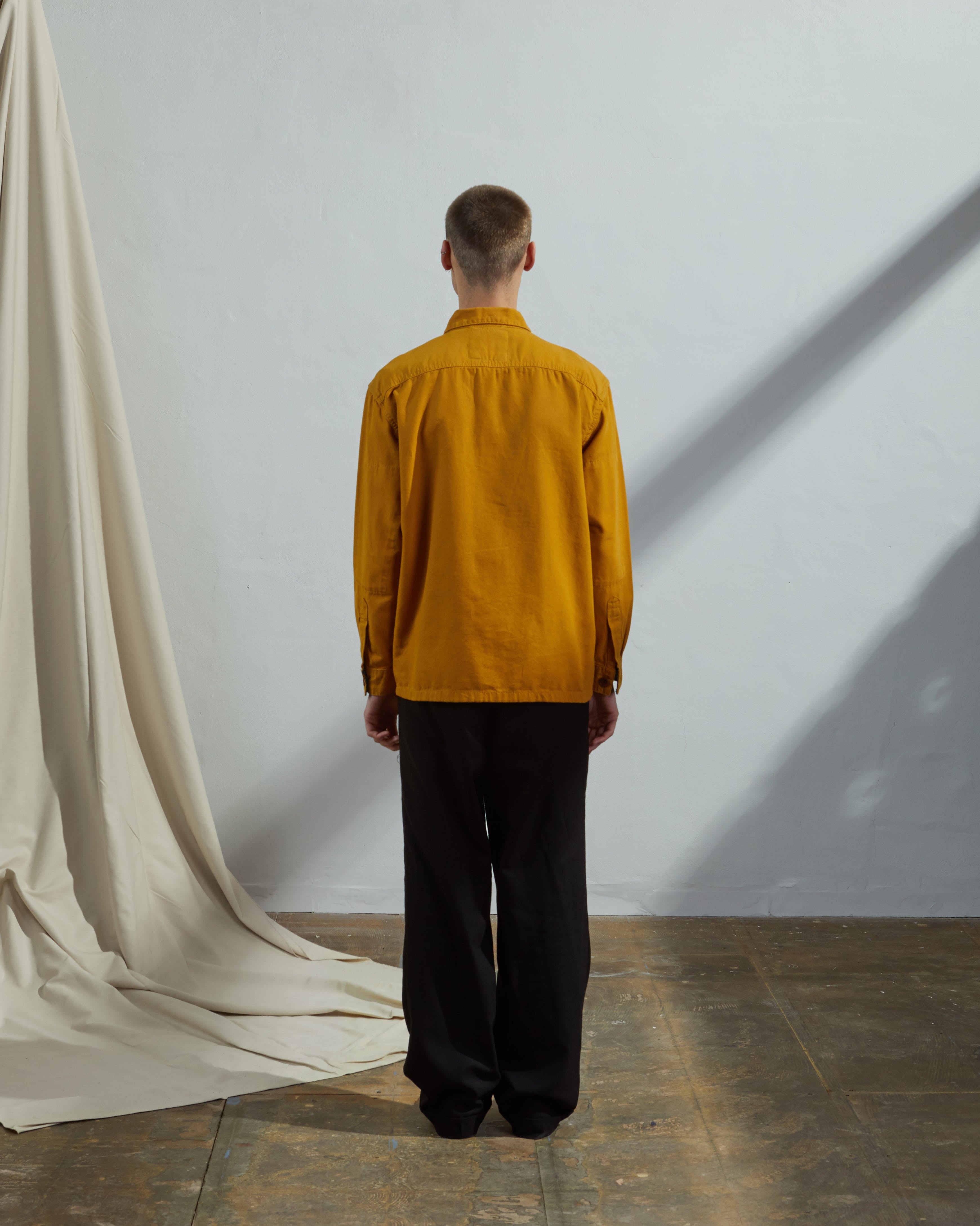 Back model shot of Uskees #3003 buttoned workshirt in yellow
