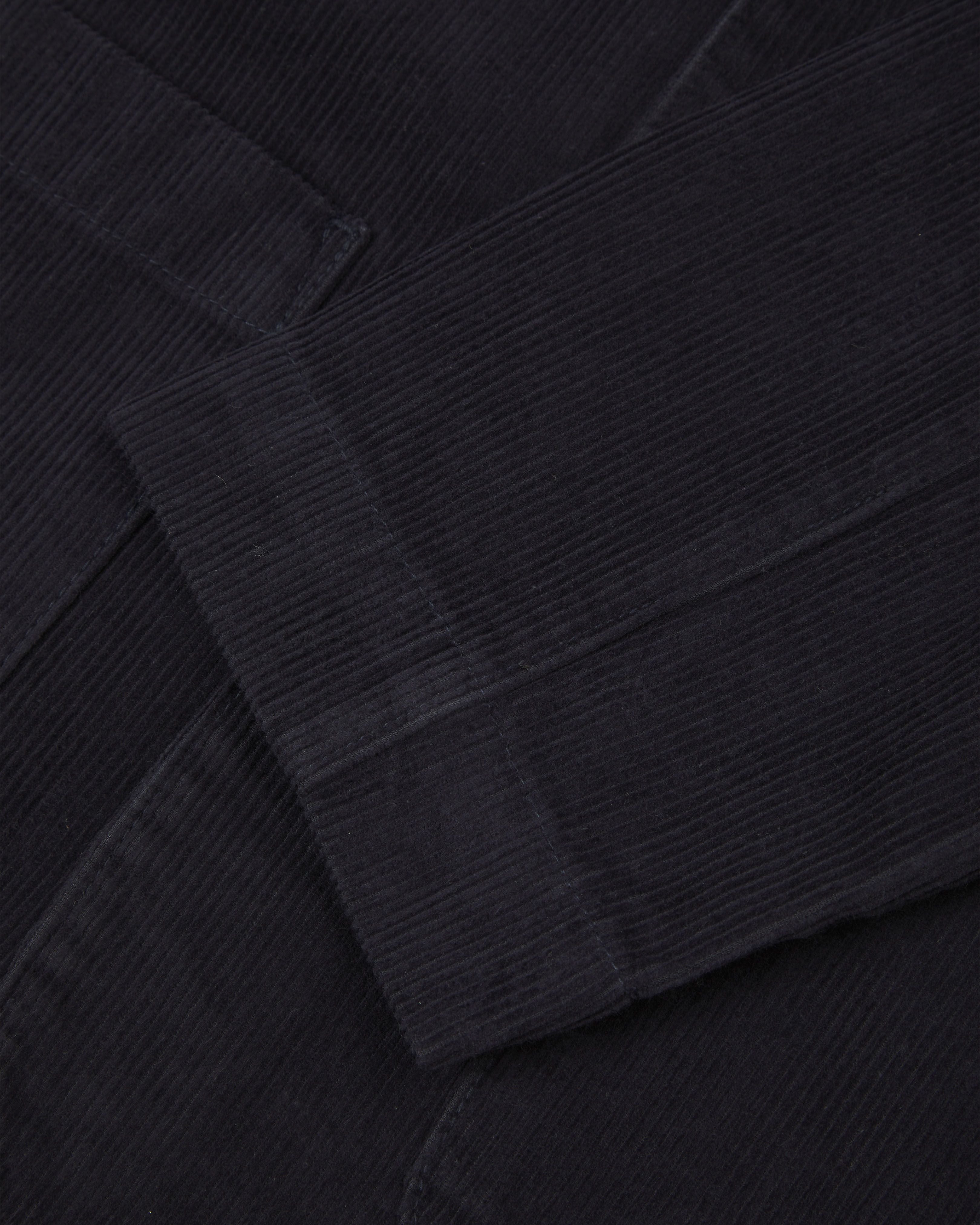 Close up view of cuff - men's corduroy dark blue blazer with 3 patch pockets from Uskees