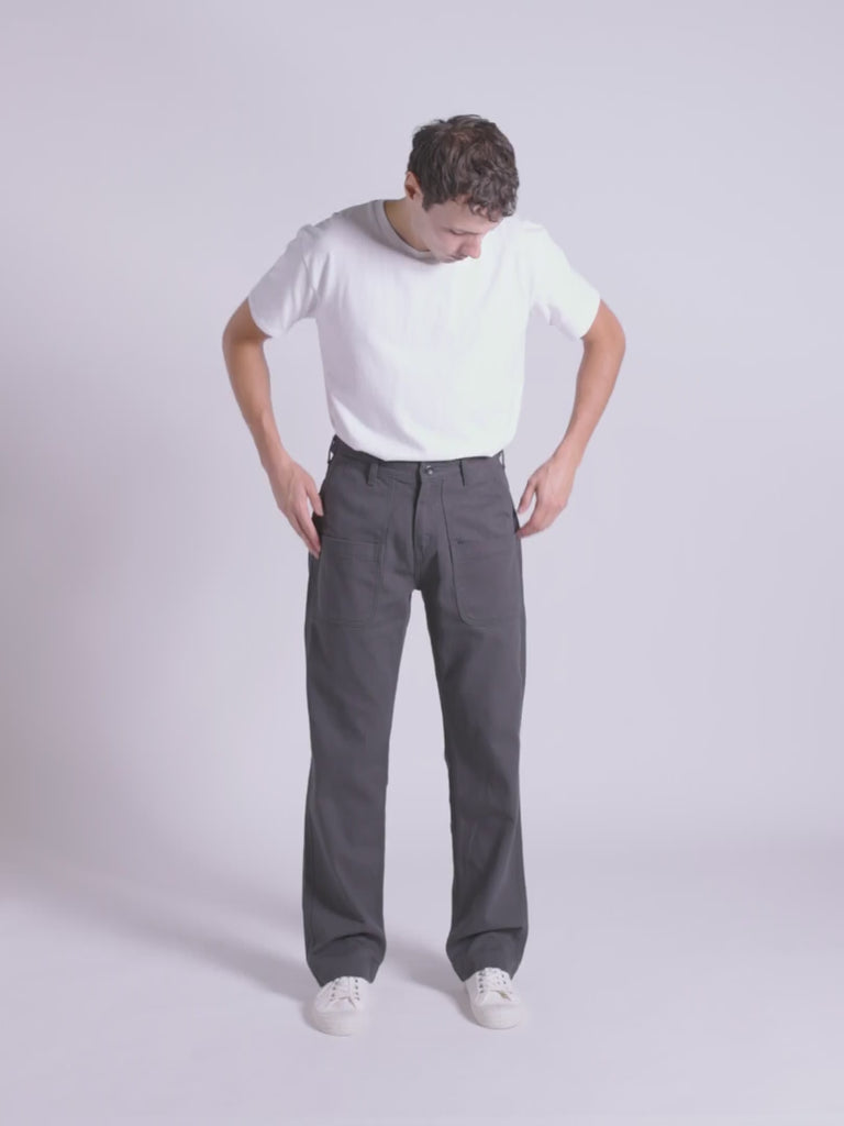 Fitting guide demonstration for the Uskees #5013 cotton drill straight leg pants with layered pockets.