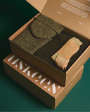 Uskees made in UK giftset in army green. Containing Alderney wool jumper, Merino wool scarf, Donegal wool hat and organic cotton socks.