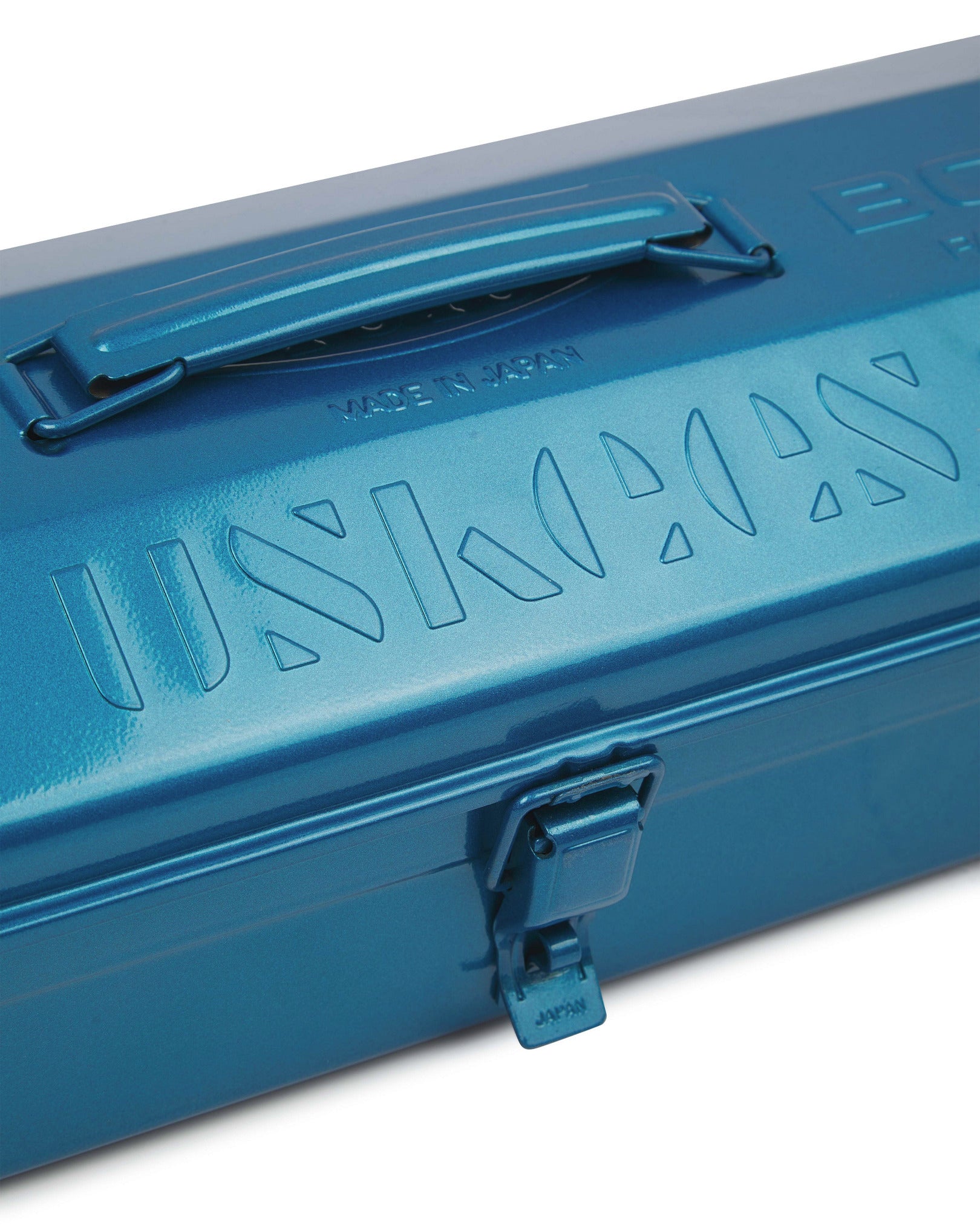 Close-up view of blue Toyo steel toolbox with focus on Uskees branding, camber-top and rounded handle.