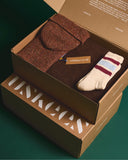 Uskees made in UK giftset in brick red. Containing Alderney wool jumper, Merino wool scarf, Donegal wool hat and sport socks.
