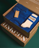 Uskees made in UK giftset in vibrant ultra blue. Containing Alderney wool jumper, Merino wool scarf, Donegal wool hat and organic sports socks.