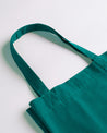 Close-up view of Uskees #4002 small tote bag in greenish-blue with focus on the robust, twin carry handles.